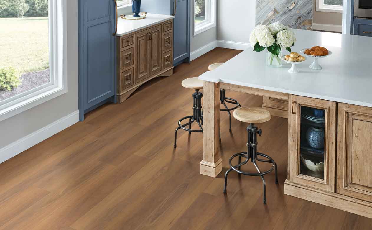 Vinyl plank kitchen floor with island and stools. 